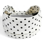 Bandeau croisé à porter dans les cheveux femme