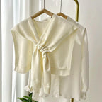 Petit châle confectionné en tricot